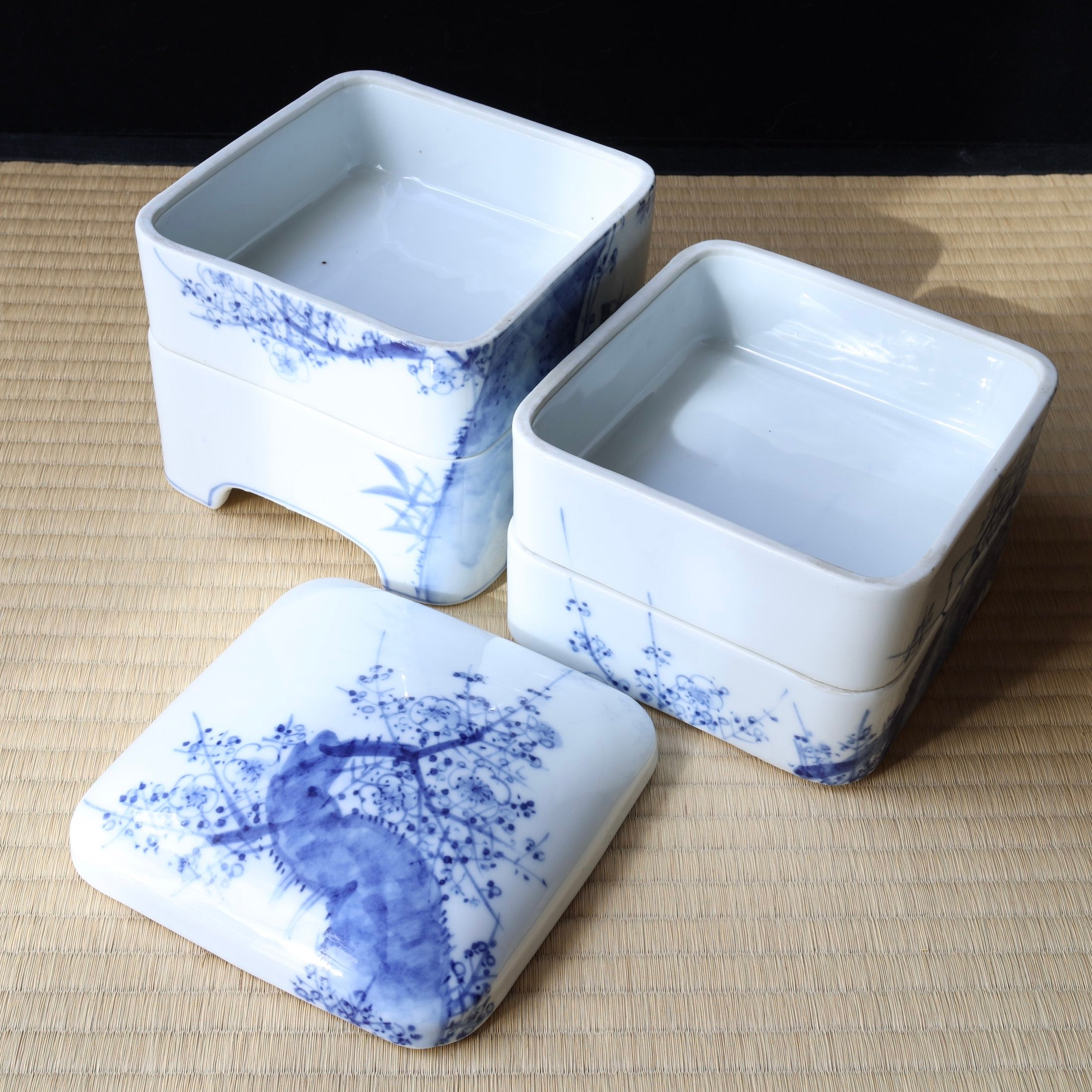 Jubako (stackable boxes) in sometsuke (underglaze blue) porcelain, with bird and plum blossom decoration, Meiji era