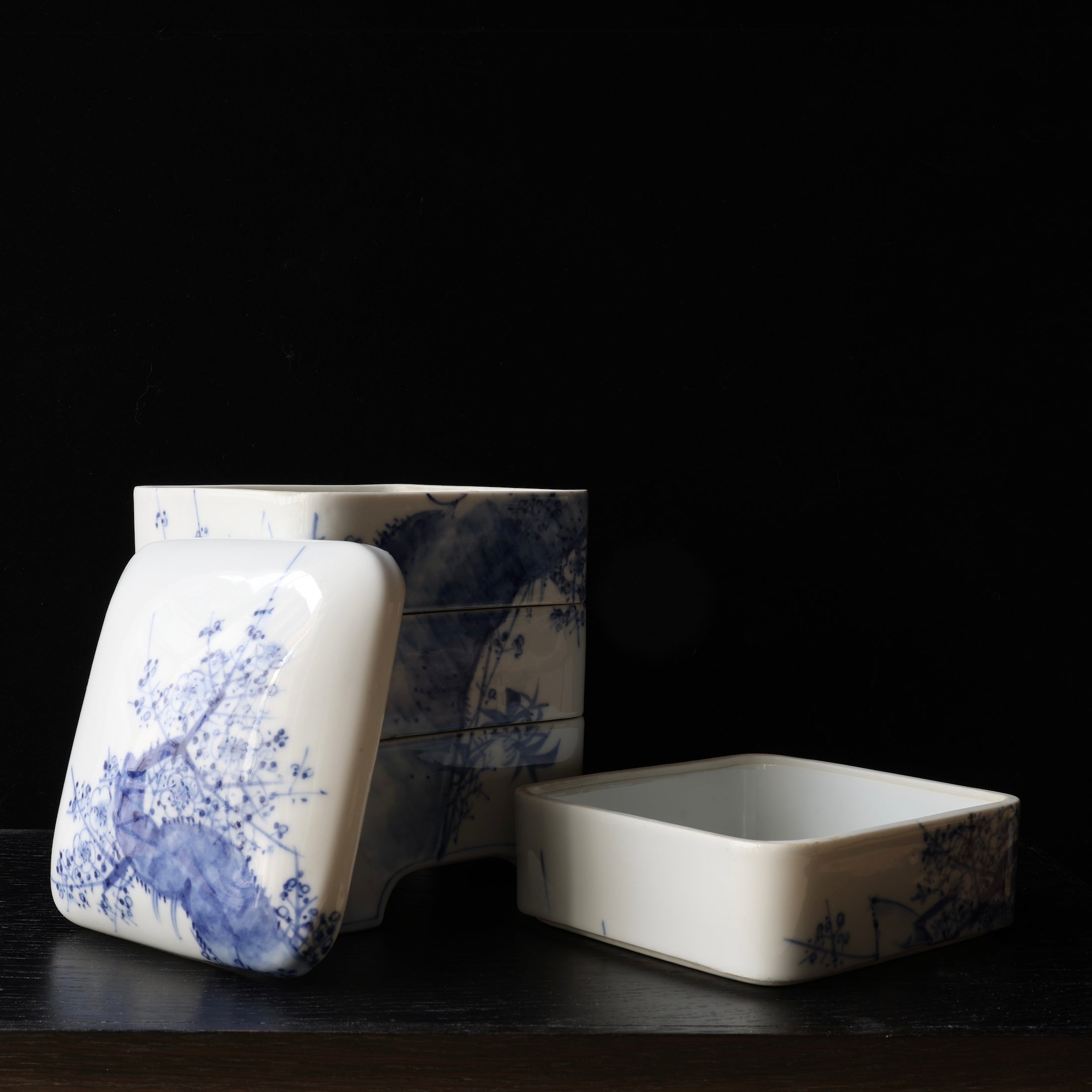 Jubako (stackable boxes) in sometsuke (underglaze blue) porcelain, with bird and plum blossom decoration, Meiji era
