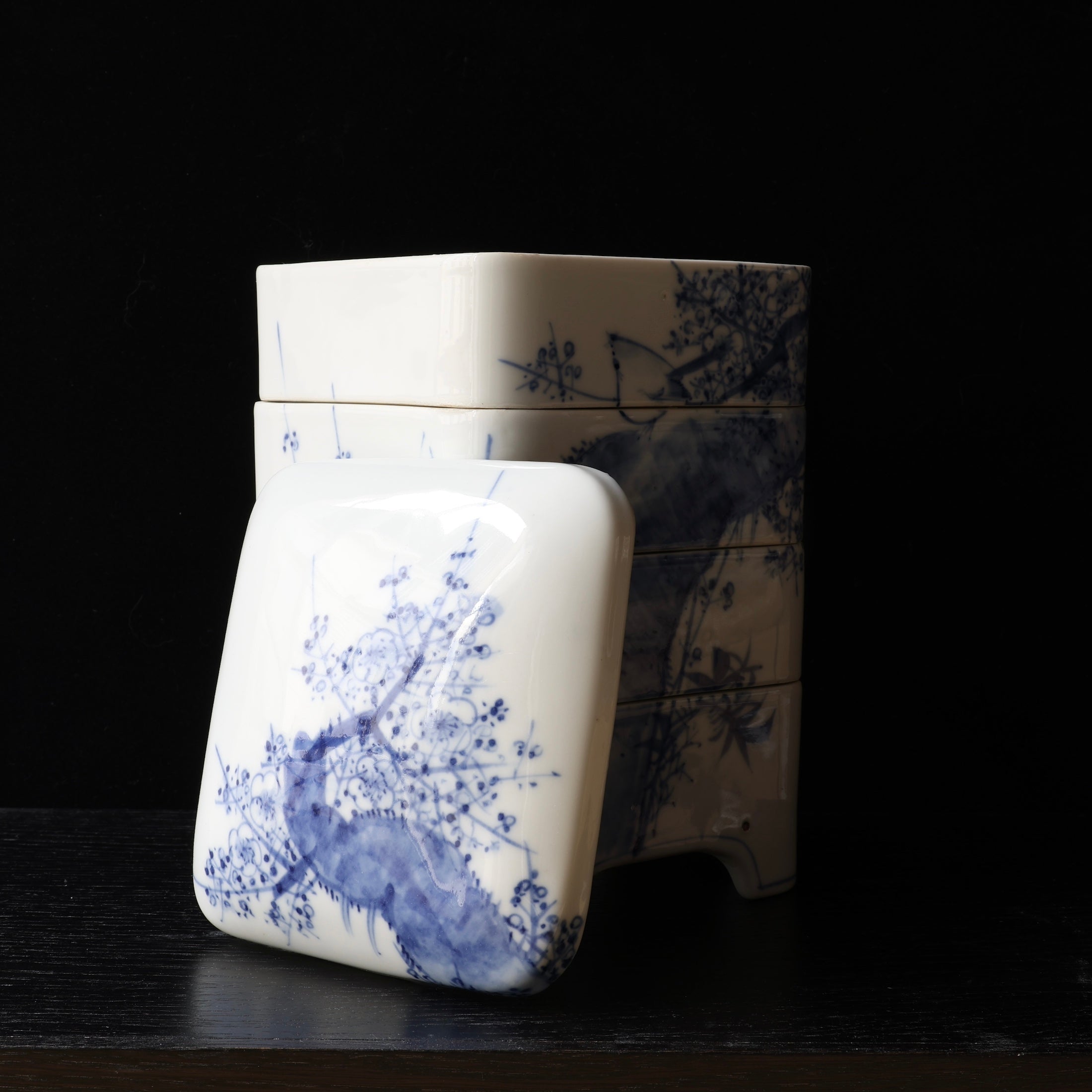 Jubako (stackable boxes) in sometsuke (underglaze blue) porcelain, with bird and plum blossom decoration, Meiji era