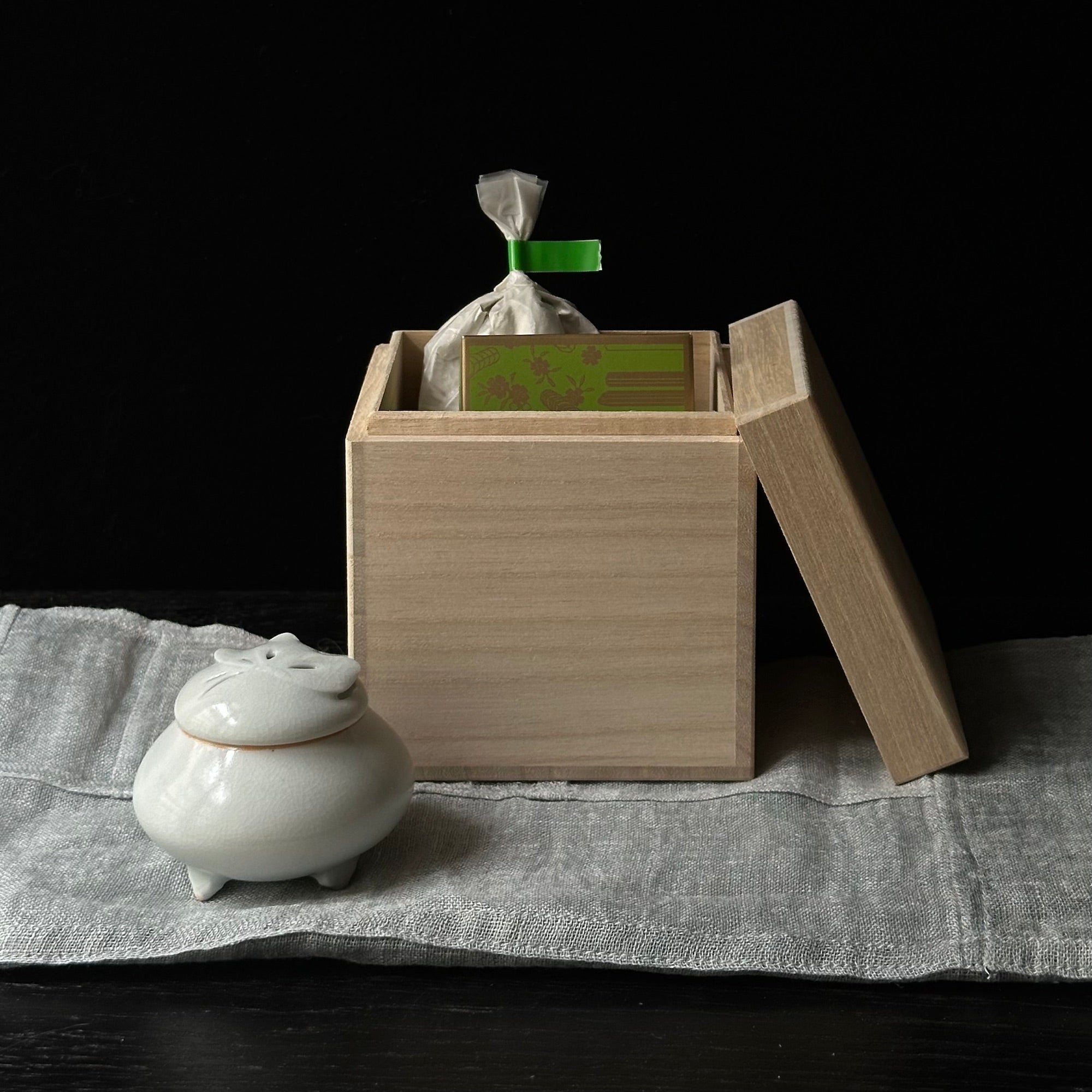 White porcelain incense holder with butterfly motif by Kyunghee Shin