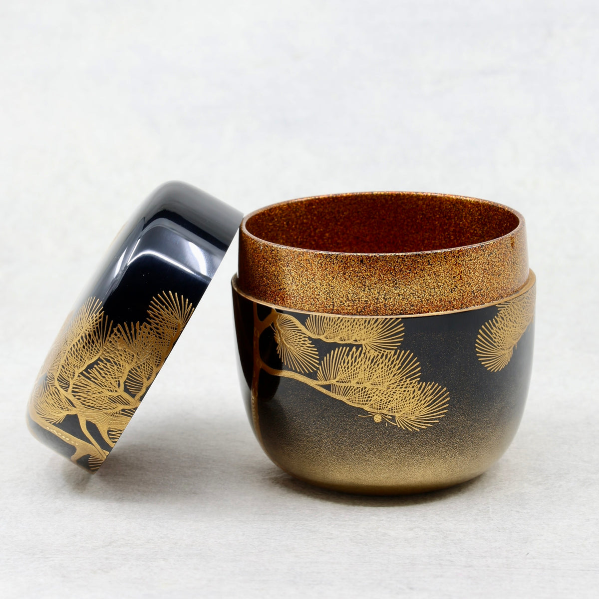 Natsume (Japanese tea caddy) in lacquer and gold, with a matsu (pine) design by Ikkō Kiyose