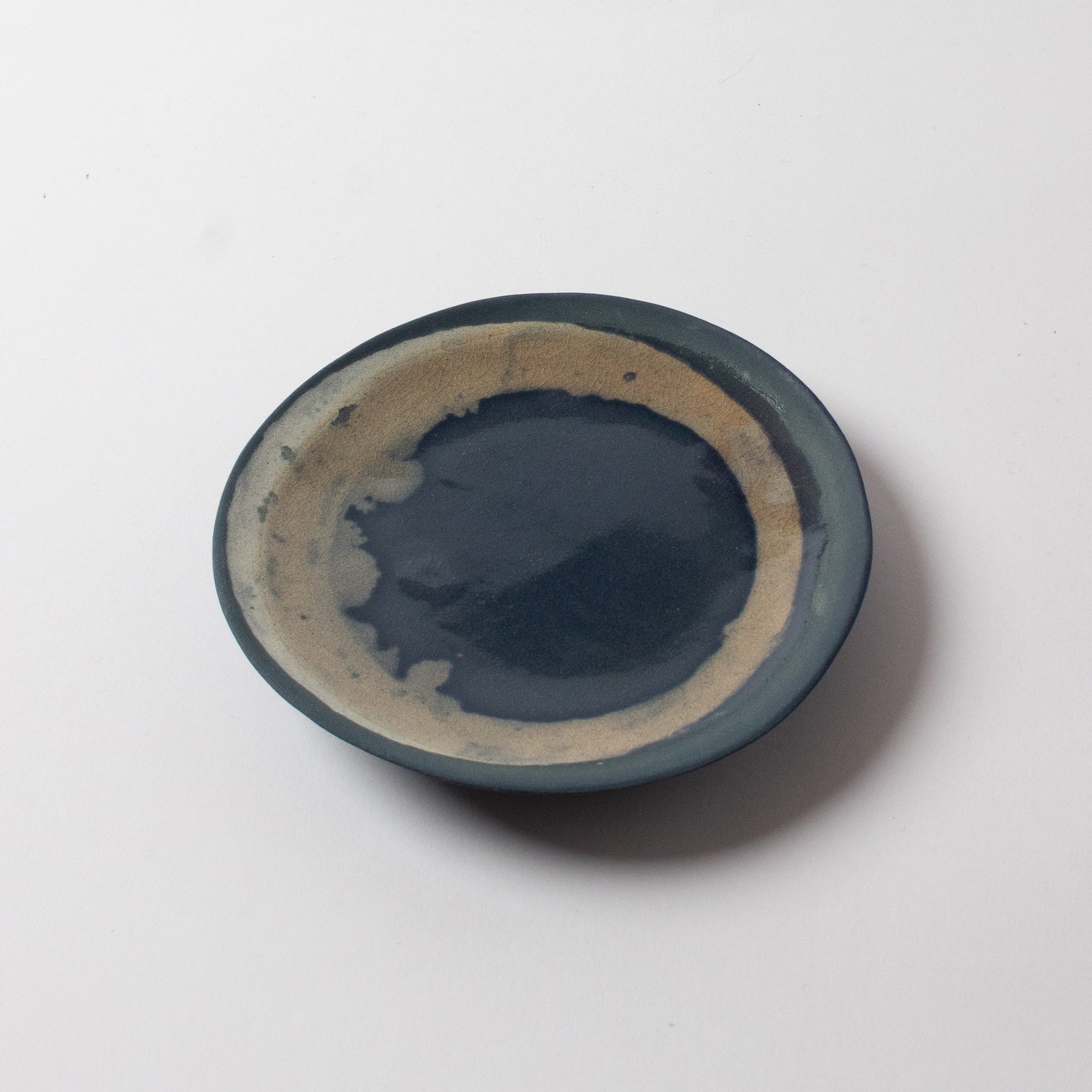Blue and beige porcelain plate by Yuna Saito 