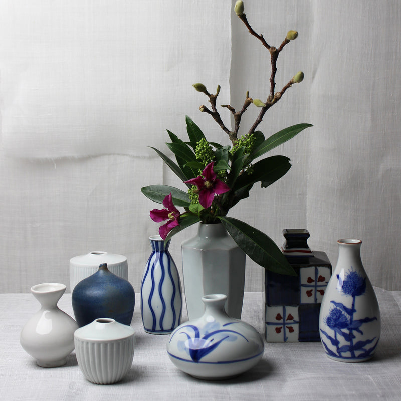 Set of 2 small white ceramic Japanese vases with blue flowers