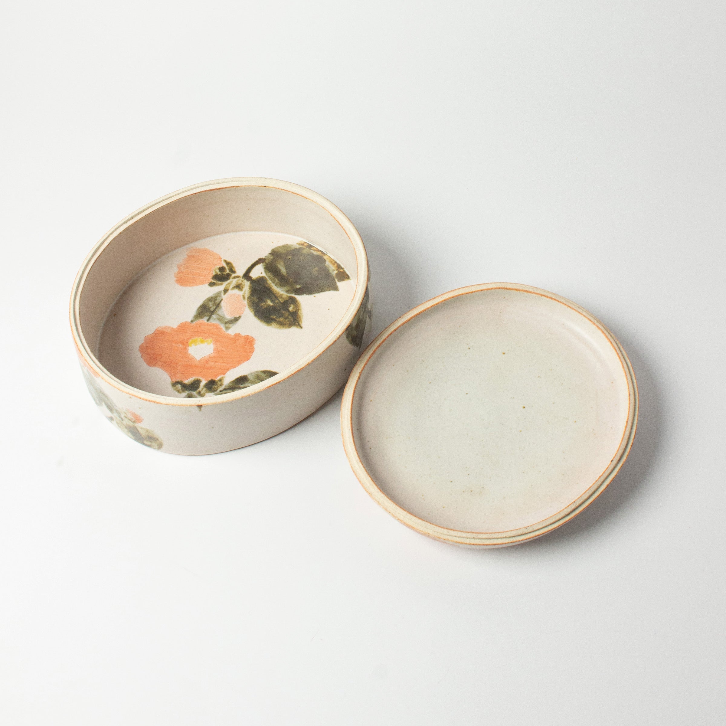Japanese ceramic box with camellia motif by Seigō Maeda