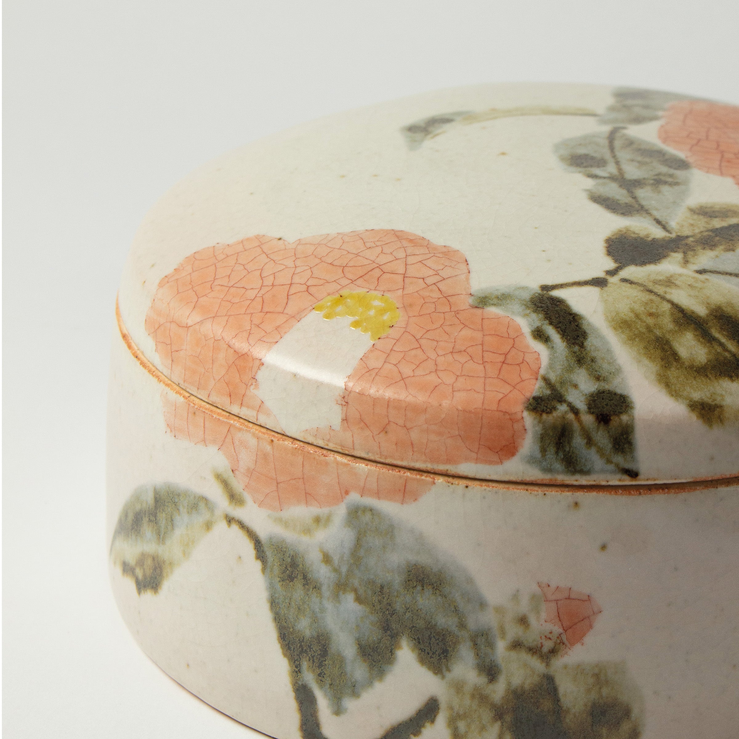 Japanese ceramic box with camellia motif by Seigō Maeda
