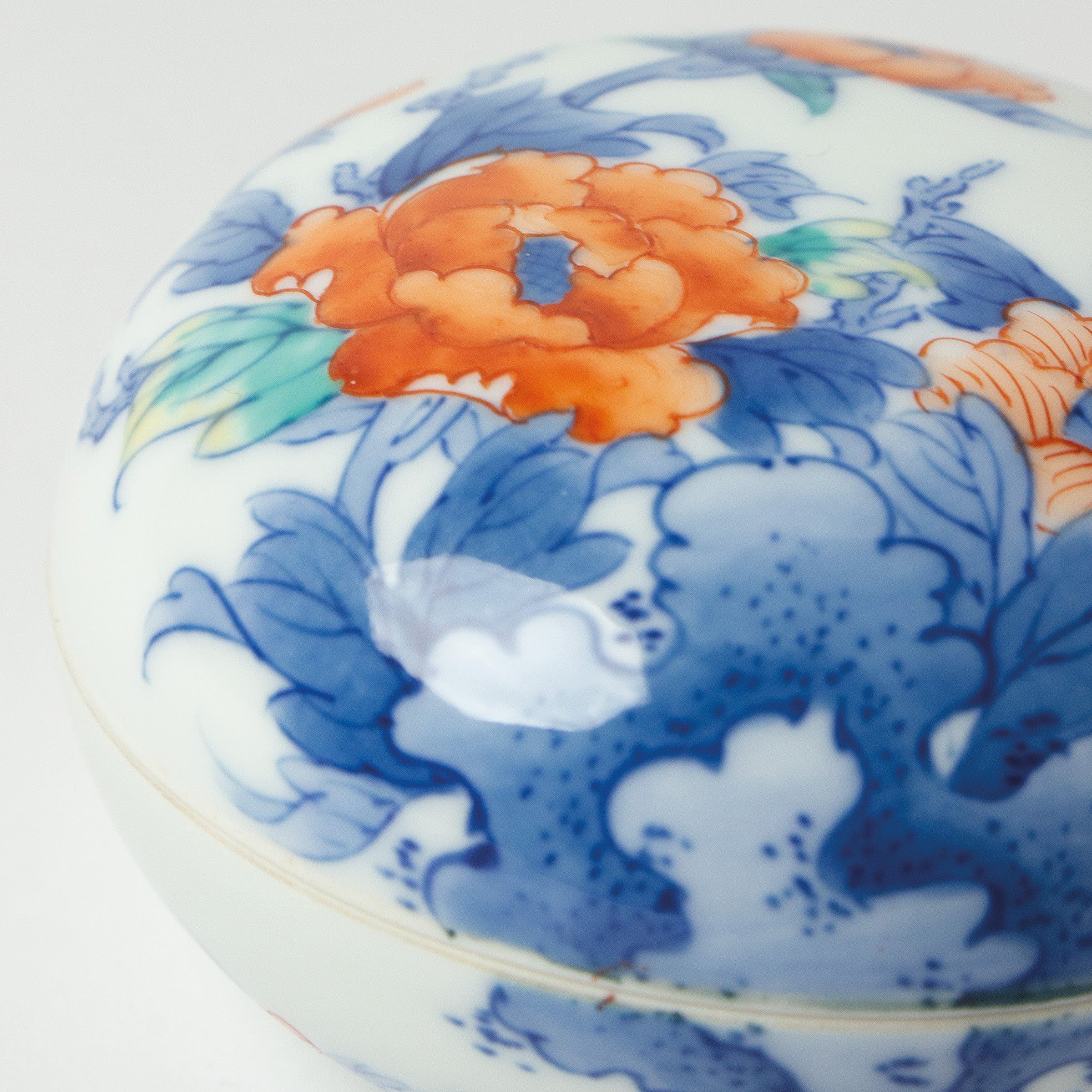 Arita Nabeshima porcelain Kōgō (incense box) with hand-painted flowers