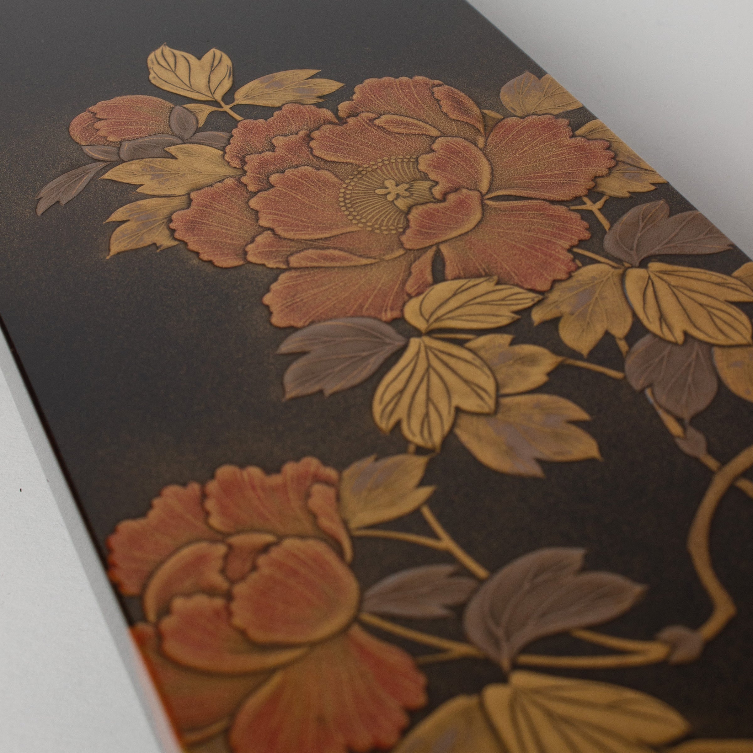 Long box in Japanese urushi lacquer, peonies in maki-e gold powder