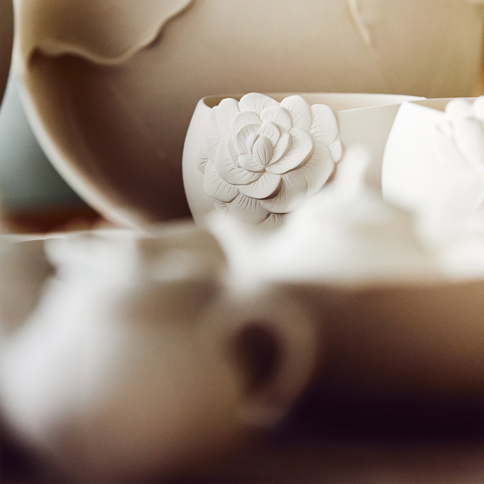 White porcelain incense holder with butterfly motif by Kyunghee Shin
