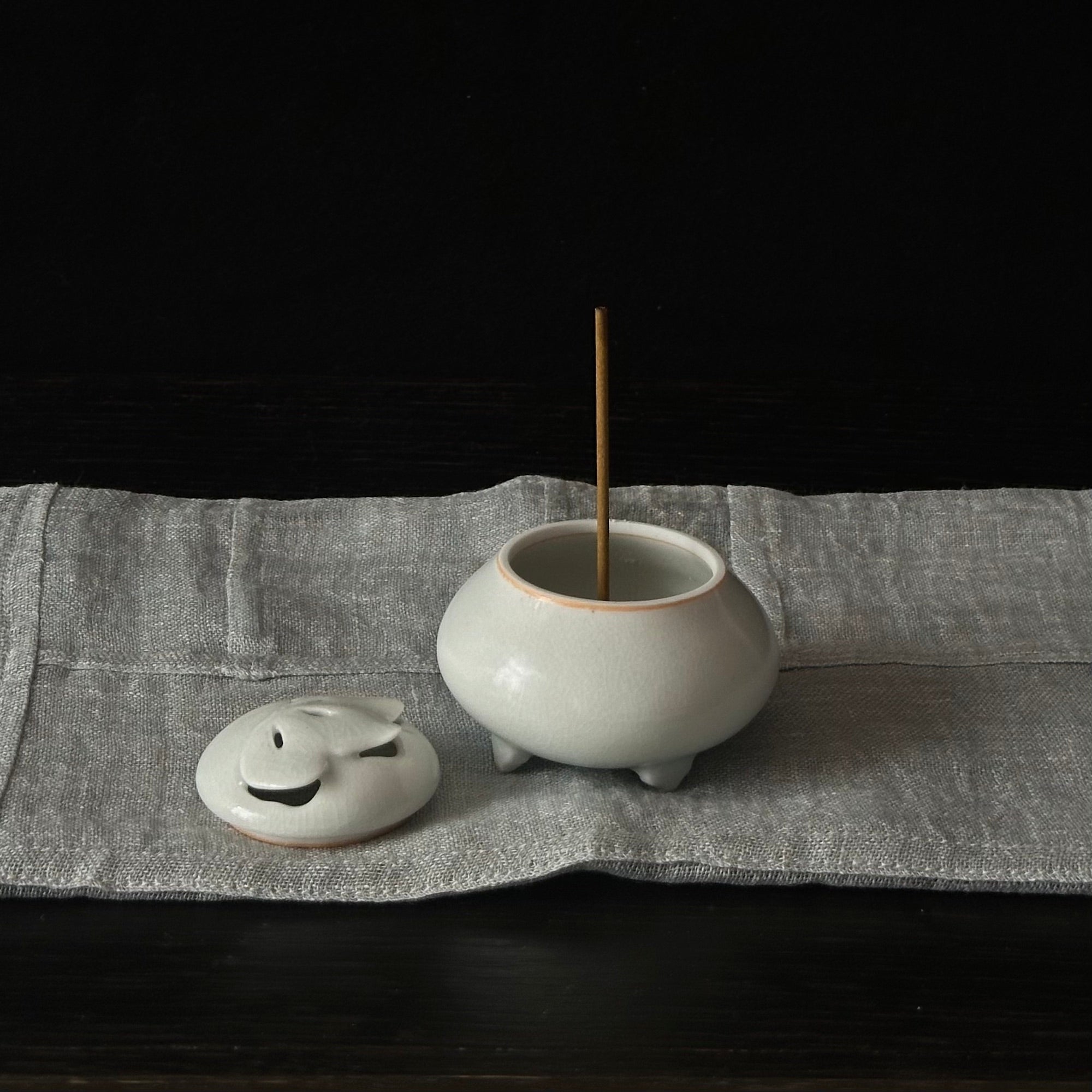White porcelain incense holder with butterfly motif by Kyunghee Shin