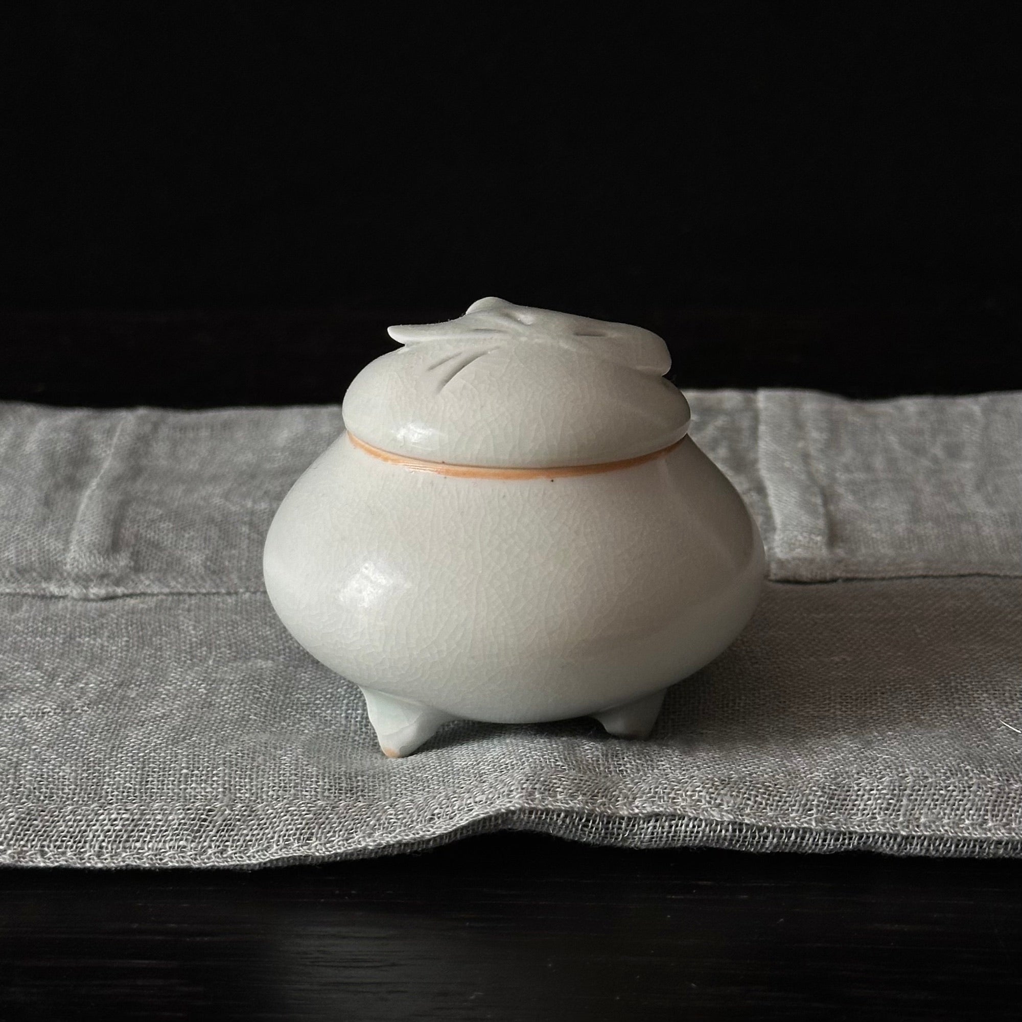 White porcelain incense holder with butterfly motif by Kyunghee Shin