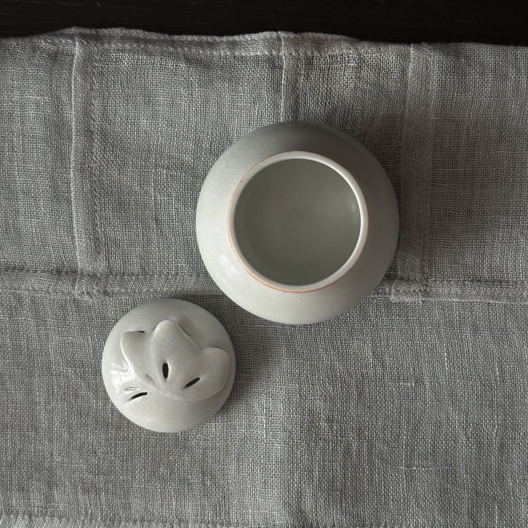 White porcelain incense holder with butterfly motif by Kyunghee Shin