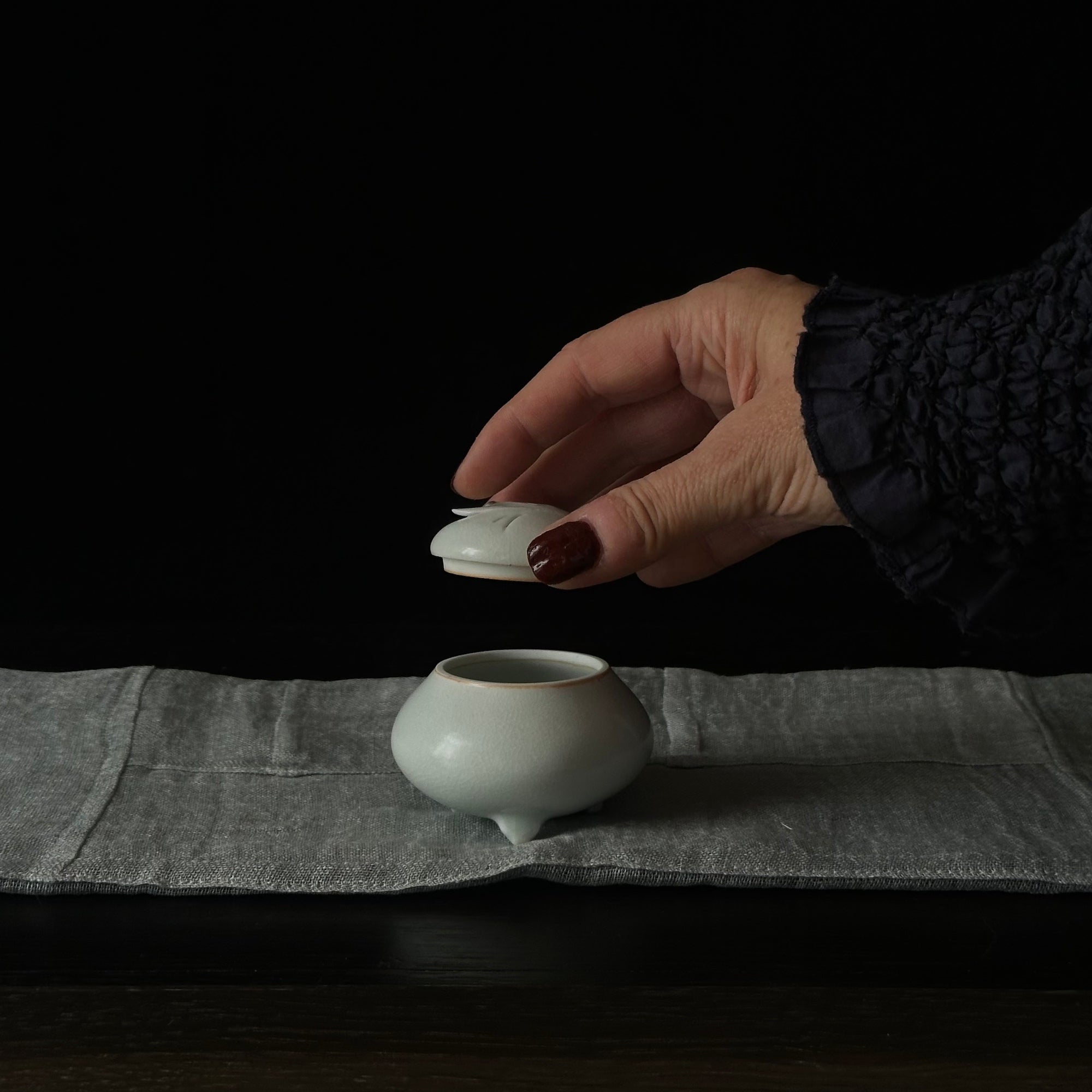 White porcelain incense holder with butterfly motif by Kyunghee Shin